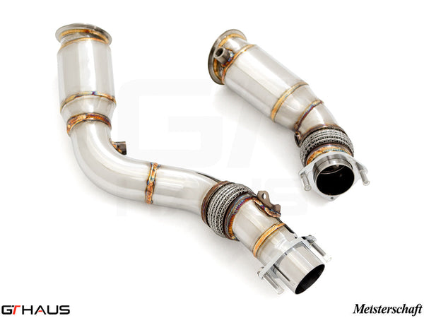 Premium down pipes for BMW F87 M2 models, featuring 90mm piping and 400 CEL sport cats for enhanced performance.