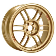 An Enkei RPF1 alloy wheel in gold finish, featuring a multi-spoke design and a brand logo in the center.
