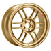 An Enkei RPF1 alloy wheel in gold finish, featuring a multi-spoke design and a brand logo in the center.