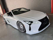 White Lexus convertible car in a garage setting