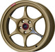 An Enkei PF06 18x7.5 gold alloy wheel with a 5x100 bolt pattern and a red Enkei logo in the center.