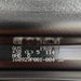 Close-up of a bicycle rim with text and numbers on a blurred background