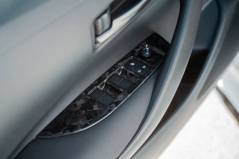 TOM'S Racing - Forged Carbon Door Switch Panel Set (LHD)- Toyota GR Corolla [2023+] / Toyota Corolla Hatchback [2019+]
