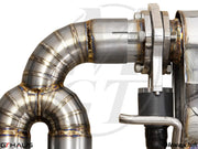 Close-up of a high-performance exhaust system for Audi TT MK II 2.0T, showcasing precision welding and valve control.