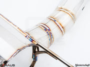 Close-up of a Meisterschaft exhaust system for BMW F30/F31/F34/F36, showcasing precision welding and stainless steel construction.