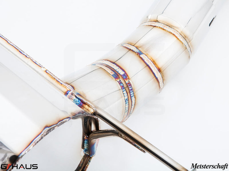 Close-up of a Meisterschaft exhaust system for BMW F30/F31/F34/F36, showcasing precision welding and stainless steel construction.