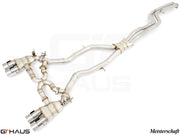 Premium performance exhaust system for BMW F87 M2 models, featuring stainless steel construction and quad tips.