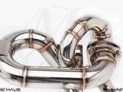 High-performance stainless steel exhaust system for Ferrari F430 Scuderia, showcasing precision welding and design.