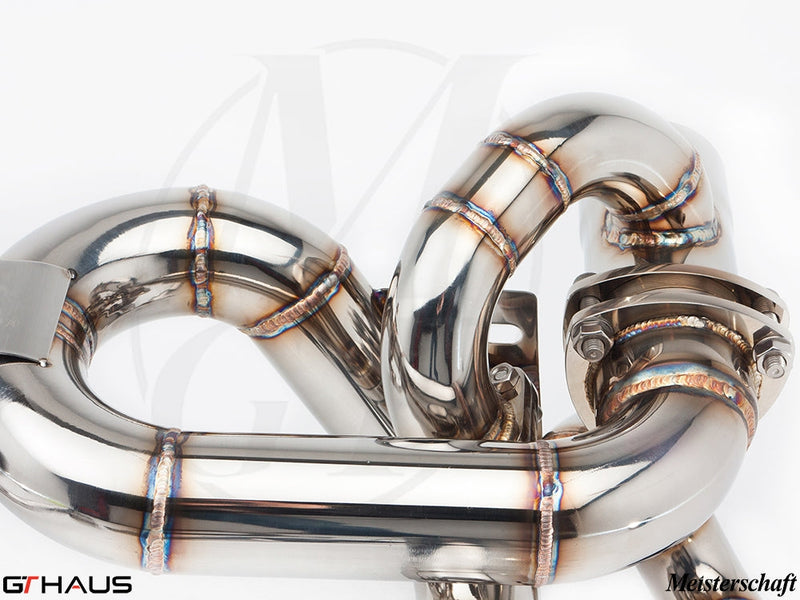 High-performance stainless steel exhaust system for Ferrari F430 Scuderia, showcasing precision welding and design.