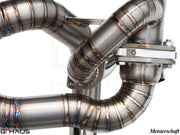 High-performance exhaust system for Ferrari F430 Scuderia, showcasing precision welding and stainless steel construction.