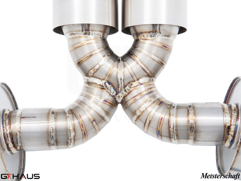 Close-up of a Meisterschaft exhaust system for Porsche 987.2 Boxster, showcasing precision welds and stainless steel construction.