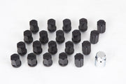 Set of black tire valve stems with a silver tool on a white background