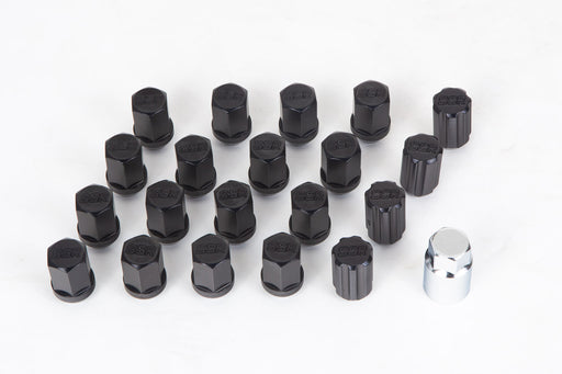 Set of black tire valve stems with a silver tool on a white background
