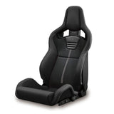 Black Recaro Sportster car seat with white stitching on a white background