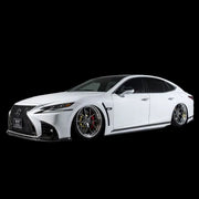 A white Lexus LS500/500h F-SPORT vehicle equipped with Aimgain VIP Sport aerodynamic parts, including a front bumper lip, side skirts, and rear diffuser, displayed against a studio background.