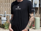 Black MEISTERSCHAFT T-shirt featuring logo, worn by a person with tattoos, showcasing a casual automotive style.