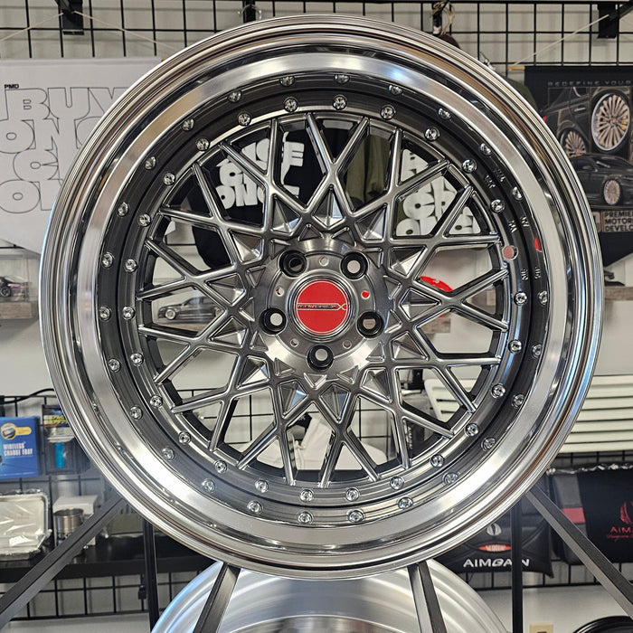 Chrome car wheel rim on display in a showroom setting